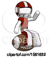 White Football Player Man Sitting On Giant Football