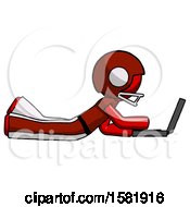 Poster, Art Print Of Red Football Player Man Using Laptop Computer While Lying On Floor Side View