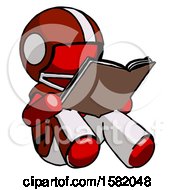 Red Football Player Man Reading Book While Sitting Down