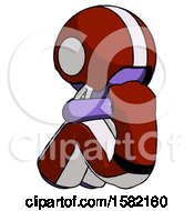 Purple Football Player Man Sitting With Head Down Back View Facing Left