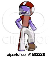 Purple Football Player Man Standing With Foot On Football
