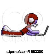 Poster, Art Print Of Purple Football Player Man Using Laptop Computer While Lying On Floor Side View