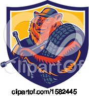 Clipart Of A Retro Woodcut Bear Mechanic Holding A Tire Wrench And Tire In A Shield Royalty Free Vector Illustration