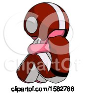 Pink Football Player Man Sitting With Head Down Back View Facing Left