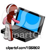 Pink Football Player Man Using Large Laptop Computer