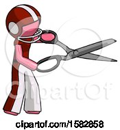 Poster, Art Print Of Pink Football Player Man Holding Giant Scissors Cutting Out Something