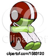 Poster, Art Print Of Green Football Player Man Sitting With Head Down Facing Angle Right