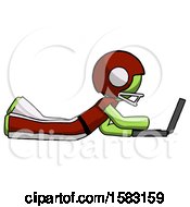 Poster, Art Print Of Green Football Player Man Using Laptop Computer While Lying On Floor Side View