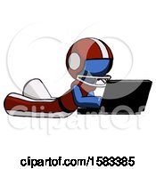 Poster, Art Print Of Blue Football Player Man Using Laptop Computer While Lying On Floor Side Angled View
