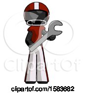 Black Football Player Man Holding Large Wrench With Both Hands