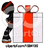 Orange Ninja Warrior Man Gift Concept Leaning Against Large Present
