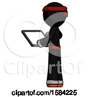 Orange Ninja Warrior Man Looking At Tablet Device Computer With Back To Viewer