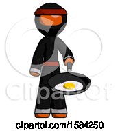 Orange Ninja Warrior Man Frying Egg In Pan Or Wok