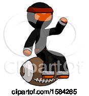 Poster, Art Print Of Orange Ninja Warrior Man Sitting On Giant Football