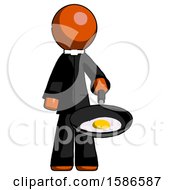 Orange Clergy Man Frying Egg In Pan Or Wok