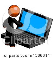 Orange Clergy Man Using Large Laptop Computer
