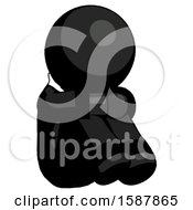 Black Clergy Man Sitting With Head Down Facing Angle Right