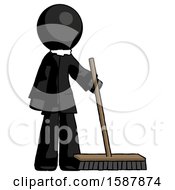 Black Clergy Man Standing With Industrial Broom