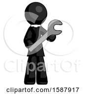 Black Clergy Man Holding Large Wrench With Both Hands