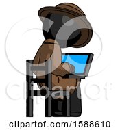Black Detective Man Using Laptop Computer While Sitting In Chair View From Back