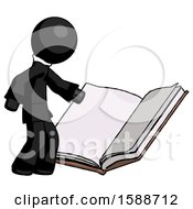 Black Clergy Man Reading Big Book While Standing Beside It