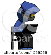 Poster, Art Print Of Blue Police Man Using Laptop Computer While Sitting In Chair Angled Right