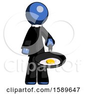 Blue Clergy Man Frying Egg In Pan Or Wok