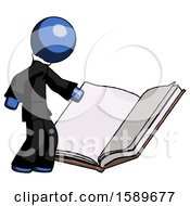 Blue Clergy Man Reading Big Book While Standing Beside It