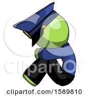 Poster, Art Print Of Green Police Man Sitting With Head Down Facing Sideways Left