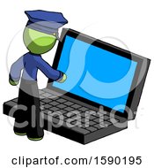 Green Police Man Using Large Laptop Computer