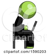 Green Clergy Man Using Laptop Computer While Sitting In Chair View From Side