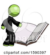 Green Clergy Man Reading Big Book While Standing Beside It