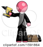 Pink Clergy Man Holding Drill Ready To Work Toolchest And Tools To Right