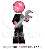 Pink Clergy Man Holding Large Wrench With Both Hands