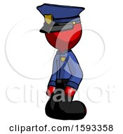 Red Police Man Kneeling Angle View Left