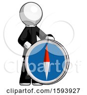White Clergy Man Standing Beside Large Compass