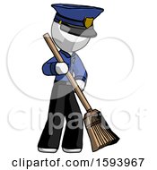 White Police Man Sweeping Area With Broom