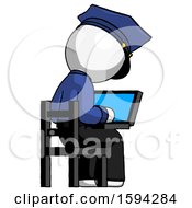 White Police Man Using Laptop Computer While Sitting In Chair View From Back