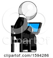 White Clergy Man Using Laptop Computer While Sitting In Chair View From Back