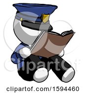 White Police Man Reading Book While Sitting Down