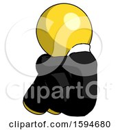 Poster, Art Print Of Yellow Clergy Man Sitting With Head Down Back View Facing Left