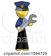 Yellow Police Man Holding Large Wrench With Both Hands