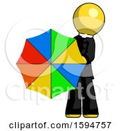 Yellow Clergy Man Holding Rainbow Umbrella Out To Viewer