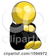 Yellow Clergy Man Sitting With Head Down Facing Angle Right