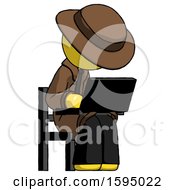 Poster, Art Print Of Yellow Detective Man Using Laptop Computer While Sitting In Chair Angled Right