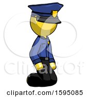 Poster, Art Print Of Yellow Police Man Kneeling Angle View Right