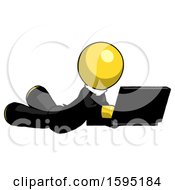 Poster, Art Print Of Yellow Clergy Man Using Laptop Computer While Lying On Floor Side Angled View