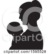 Black Silhouetted Mother Holding A Baby