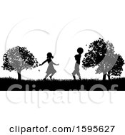 Poster, Art Print Of Silhouetted Children Playing In A Park