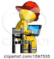Yellow Firefighter Fireman Man Using Laptop Computer While Sitting In Chair View From Back